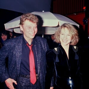 ARCHIVES - JOHNNY HALLYDAY ET NATHALIE BAYE EN SOIREE 00/00/0001 - 