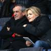 Thierry Ardisson et sa femme Audrey Crespo-Mara assistent au match opposant PSG à Reims, lors de la 27e journée de Ligue 1 au Parc des Princes à Paris, le 20 février