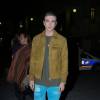 Gabriel-Kane Day-Lewis (fils d'Isabelle Adjani) arrive à la Bourse de commerce pour assister au défilé H&M Studio. Paris, le 2 mars 2016.