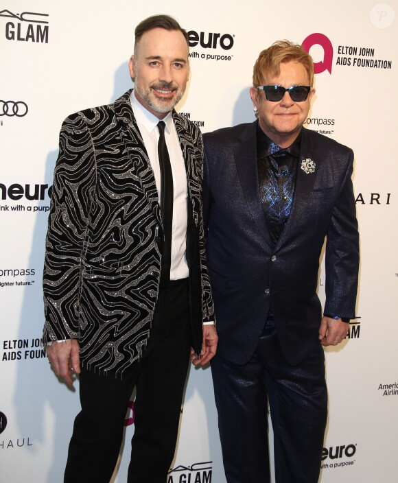 David Furnish et son mari Elton John à la soirée Elton John AIDS foundation 2016 à West Hollywood Park à West Hollywood, le 28 février 2016