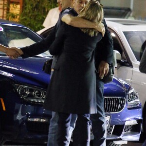 Exclusif - George Clooney embrasse une inconnue sur le parking du restaurant Sushi Asanebo, à Los Angeles, le 16 mars 2016.