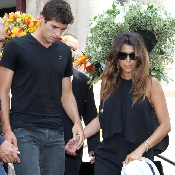 Yoann Gourcuff et sa compagne Karine Ferri rendent un dernier hommage à Tiburce Garou le 10 juillet 2015.