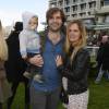 Gontran Cherrier avec sa femme Jenny Del Pino et leur fils Marin lors des "Dimanches au Galop" à l'Hippodrome d'Auteuil à Paris le 17 Avril 2016. © Guirec Coadic / Bestimage