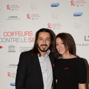 Moundir et sa femme Inès lors de l'opération " Coiffeurs Contre le Sida " édition 2014 à l'Académie L'Oréal Produits Professionnels à Paris, le 1er décembre 2014.