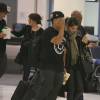 Exclusif - Orlando Bloom et Selena Gomez (sac Prada modèle Saffiano) quittent l'aéroport de LAX à Los Angeles, le 20 octobre 2014