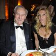 Gérard de Villiers et sa compagne Sylvie Elias à Paris, le 11 décembre 2011.