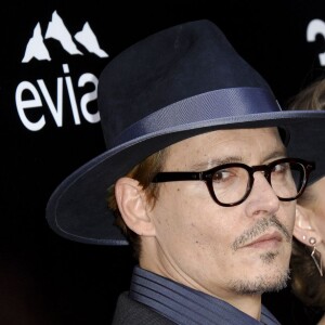 Johnny Depp et sa fiancée Amber Heard - Première du film "3 Days to Kill" à Hollywood, le 12 février 2014