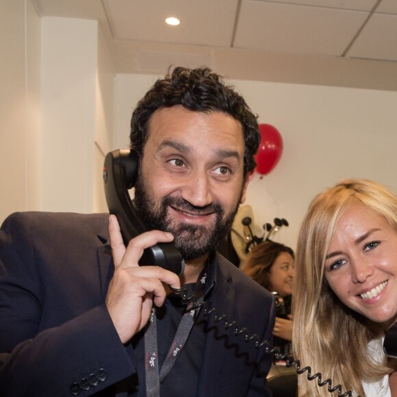 Cyril Hanouna et Enora Malagré - 11ème édition du "BGC Charity Day" à Paris le 11 septembre 2015 en mémoire aux 658 collaborateurs du groupe BGC partners (leader mondial du courtage interbancaire) disparus il y a 14 ans dans les attentats du World Trade Center le 11 septembre 2001. Les people sont courtier d'un jour pour encourager les clients à passer ce jour là le maximum d'ordres dans la salle des marchés d'Aurel BGC au 62, rue de Richelieu 75002 Paris. Chaque 11 septembre , la totalité du chiffre d'affaire réalisé par le groupe sera reversée à des associations.