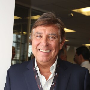 Charity Day BGC 2014 - Jean-Pierre Foucault - Courtier d'un jour pour encourager les clients à passer ce jour là le maximum d'ordres dans la salle des marchés d'Aurel BGC Rue Vivienne à Paris. Le 11 septembre 2014