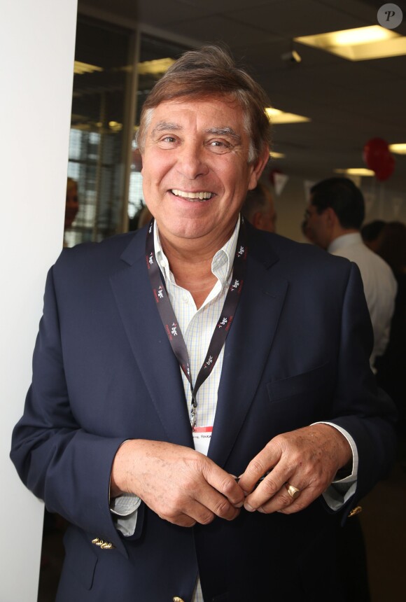 Charity Day BGC 2014 - Jean-Pierre Foucault - Courtier d'un jour pour encourager les clients à passer ce jour là le maximum d'ordres dans la salle des marchés d'Aurel BGC Rue Vivienne à Paris. Le 11 septembre 2014