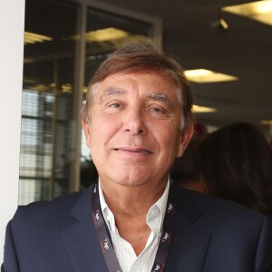 Charity Day BGC 2014 - Jean-Pierre Foucault - Courtier d'un jour pour encourager les clients à passer ce jour là le maximum d'ordres dans la salle des marchés d'Aurel BGC Rue Vivienne à Paris. Le 11 septembre 2014