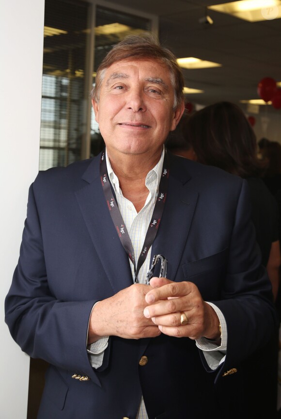 Charity Day BGC 2014 - Jean-Pierre Foucault - Courtier d'un jour pour encourager les clients à passer ce jour là le maximum d'ordres dans la salle des marchés d'Aurel BGC Rue Vivienne à Paris. Le 11 septembre 2014
