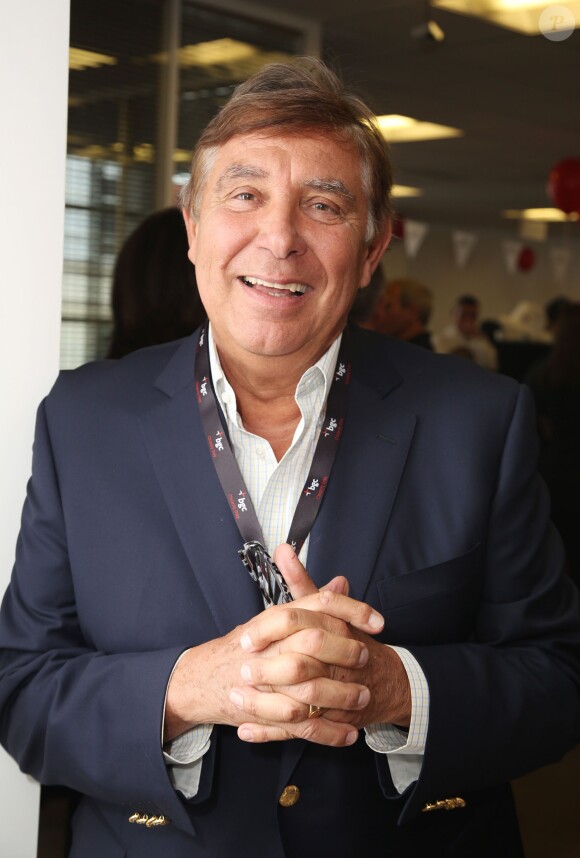 Charity Day BGC 2014 - Jean-Pierre Foucault - Courtier d'un jour pour encourager les clients à passer ce jour là le maximum d'ordres dans la salle des marchés d'Aurel BGC Rue Vivienne à Paris. Le 11 septembre 2014