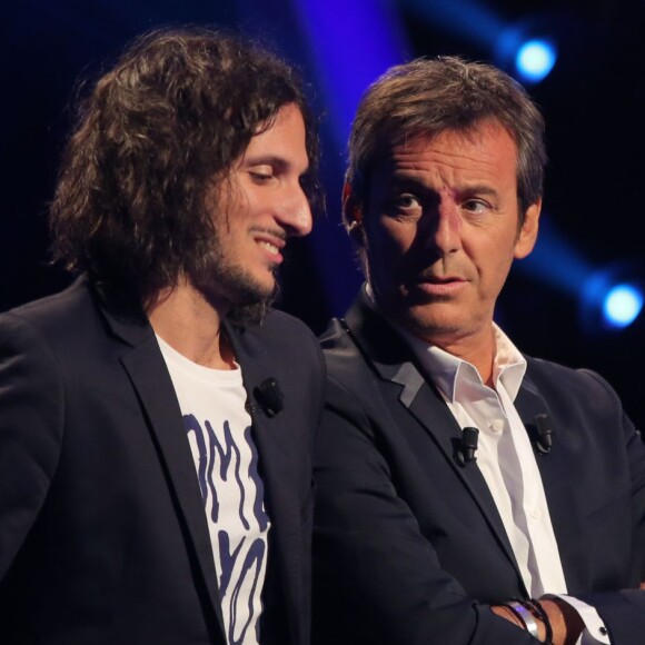 Exclusif - Jean-Luc Reichmann joue avec Xavier Mercier, gagnant des 12 coups de midi au profit de l'Association SOS Addictions, lors du tournage de l'émission spéciale des 15 ans de Qui veut gagner des millions ? (tournage le lundi 31 août 2015, diffusion le samedi 5 septembre 2015 à 20h55 sur TF1).