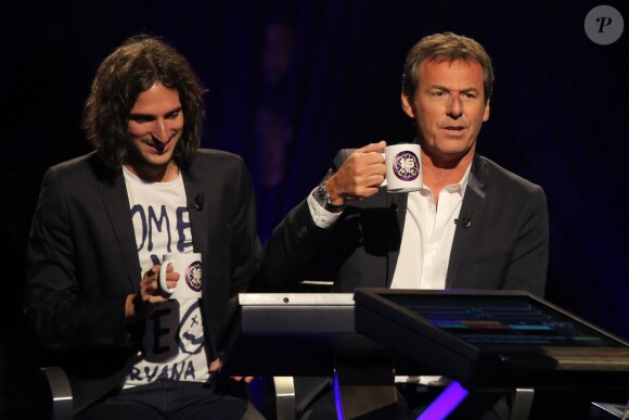 Exclusif - Jean-Luc Reichmann joue avec Xavier Mercier, gagnant des 12 coups de midi au profit de l'Association SOS Addictions, lors du tournage de l'émission spéciale des 15 ans de Qui veut gagner des millions ? (tournage le lundi 31 août 2015, diffusion le samedi 5 septembre 2015 à 20h55 sur TF1).