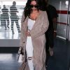 Kim Kardashian et son mari Kanye West quittent Paris pour Los Angeles à l'aéroport de Roissy-Charles-de-Gaulle le 14 juin 2016.