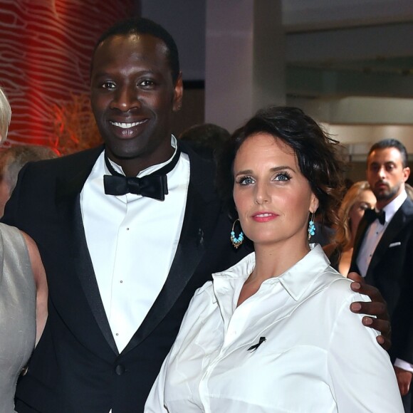 Maïtena Biraben, Omar Sy et sa femme Hélène - 68ème gala de la Croix-Rouge monégasque dans la salle des Etoiles du Sporting Monte-Carlo à Monaco, le 23 juillet 2016. © Bruno Bebert/Bestimage
