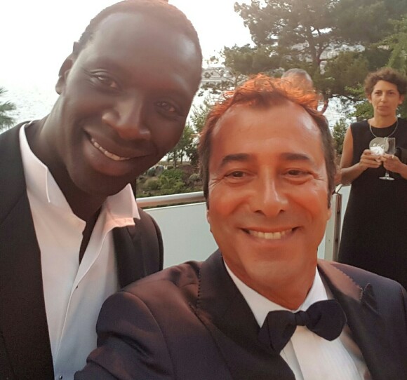 Omar Sy et Bernard Montiel au 68ème gala de la Croix-Rouge Monégasque dans la salle des Etoiles du Sporting Monte-Carlo à Monaco, le 23 juillet 2016.