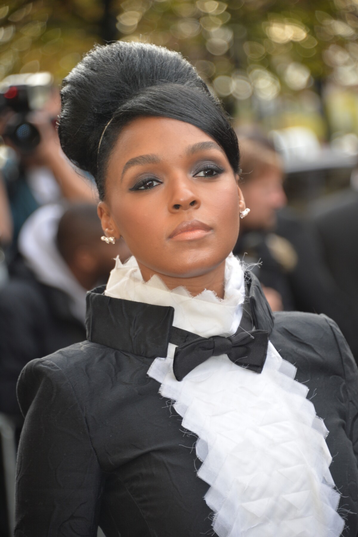 Janelle Monáe at Chanel Spring/Summer 2016 Paris Fashion Week wearing dress  from the Fall 2015 Collection, Chanel accessories and sandals by Oscar  Tiye. [600x900] : r/fashionporn