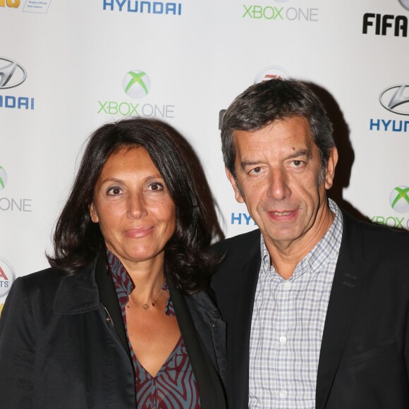 Michel Cymes et sa femme Nathalie - Soirée de lancement du jeu vidéo "FIFA 2016" au Faust à Paris, le 21 septembre 2015.