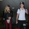 Chloë Grace Moretz et son compagnon Brooklyn Beckham arrivent à l'aéroport de LAX à Los Angeles, le 29 juin 2016