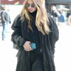 Gigi Hadid is spotted wheeling her luggage in NYC. The supermodel warms up in an oversized jacket as she flashes a small smile to the cameras. She grips her phone tight while making her way to her destination after wishing sister Bella Hadid congratulations on her achievement of being the newest Victoria's Secret angel, New York City, NY, USA on October 26, 2016. Photo by AKM-GSI/ABACAPRESS.COM27/10/2016 - New York City