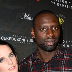 Omar Sy et sa femme Hélène au vernissage de l'exposition "Vision by AG", au profit de l'association caritative CeKeDuBonheur, à la Piscine Molitor à Paris, le 30 novembre 2016.