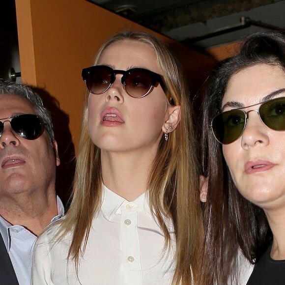 Amber Heard arrive au tribunal pour sa déposition contre Johnny Depp pour violences conjugales dans la procédure de divorce à Century City, le 13 août 2016.