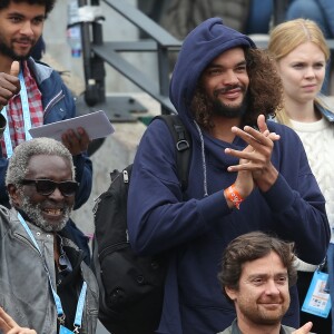 Joakim Noah et son grand-pére Zacharie dans les tribunes des internationaux de France de Roland Garros à Paris le 4 juin 2016. © Moreau - Jacovides / Bestimage