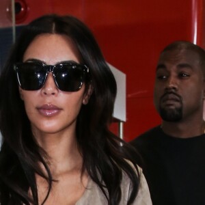 Pascal Duvier (garde du corps) escorte Kim Kardashian et son mari Kanye West quittent Paris pour Los Angeles à l'aéroport de Roissy-Charles-de-Gaulle le 14 juin 2016.