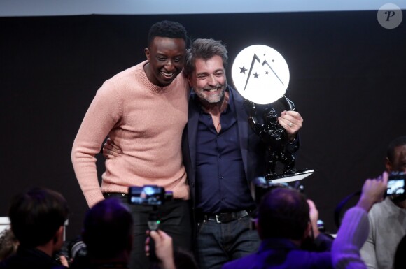 Ahmed Sylla et Ludovic Bernard, grand prix-OCS et prix du public, lors de la cérémonie de clôture du 20e Festival du film de comédie à l'Alpe d'Huez, le 21 janvier 2017. © Dominique Jacovides/Bestimage