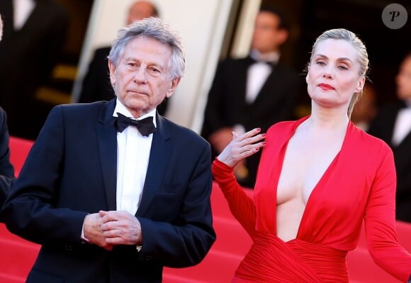 Roman Polanski et sa femme Emmanuelle Seigner lors de la montée des marches pour la projection de La Venus à la fourrure au 66e Festival de Cannes, en mai 2013