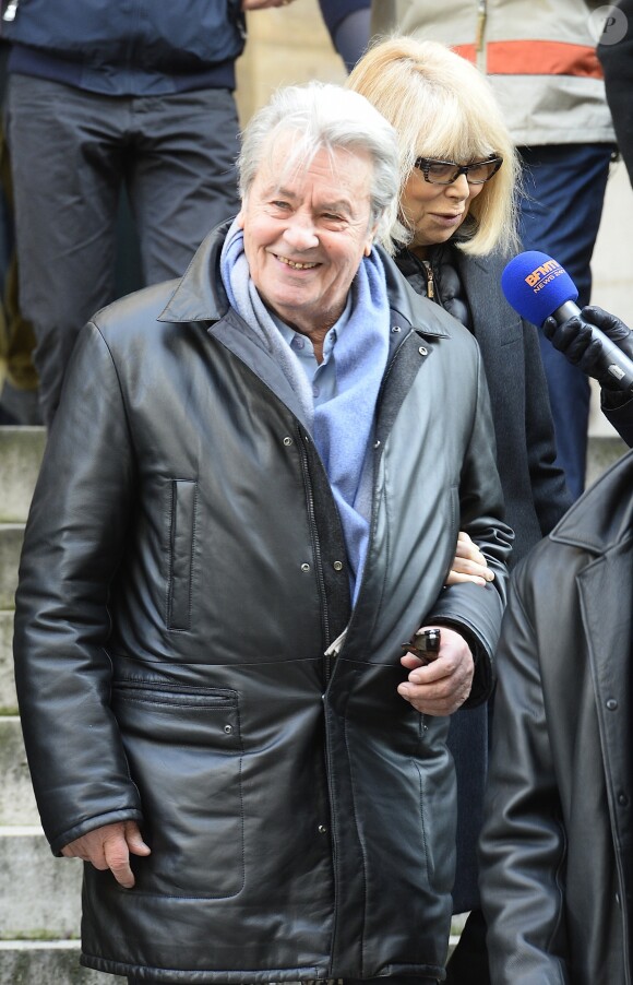 Alain Delon et Mireille Darc - Hommage à Georges Lautner en l'église Saint-Roch à Paris. Le 5 decembre 2013