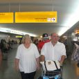 Debbie Rowe et son fiancé Marc Schaffel, en compagnie du jeune chanteur belge Ian Thomas dont ils sont les managers, arrivent à l'aéroport de Sao Paulo au Brésil, le 26 août 2014.