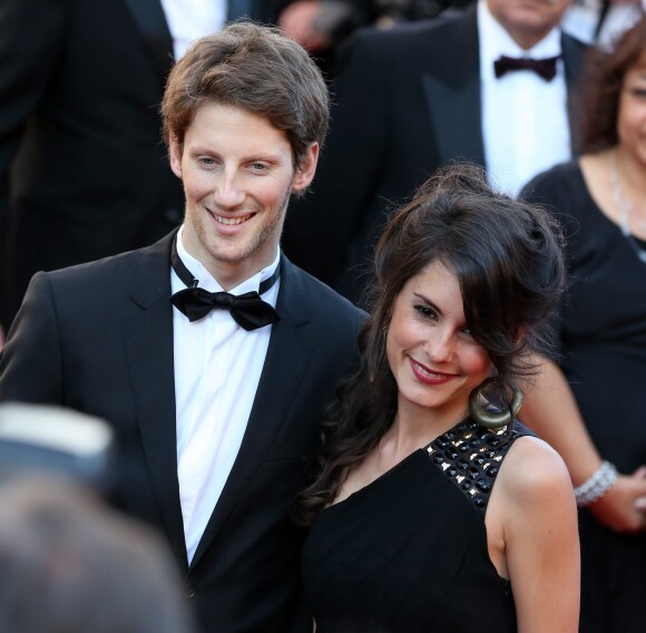 Le pilote de Formule 1 Romain Grosjean et sa compagne Marion Jollès - Montée des marches du film "Killing Them Softly" lors du 65e Festival de Cannes, le 22 mai 2012.
