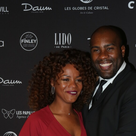 Teddy Riner et sa compagne Luthna Plocus au photocall de la 11ème cérémonie des Globes de Cristal au Lido à Paris le 30 janvier 2017. © CVS / Bestimage