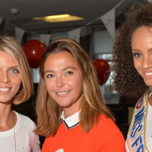 Sylvie Tellier, Sandrine Quetier et Alicia Aylies (Miss France 2017) lors de la 13ème édition du Charity Day dans la salle des marchés d'Aurel BGC dans le quartier de la Bourse à Paris le 11 septembre 2017. © Veeren / Bestimage