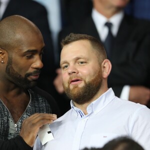 Teddy Riner assiste au match de Champions League "PSG - Bayern Munich (3-0)" au Parc des Princes à Paris, le 27 septembre 2017. © Cyril Moreau/Bestimage