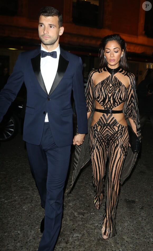 Nicole Scherzinger et son compagnon Grigor Dimitrov quittent la soirée des British Fashion Awards à Londres le 5 December 2016.