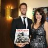 Romain Grosjean et son épouse Marion Jollès-Grosjean (enceinte) posent pour la promotion de leur livre de recettes de cuisine "Cuisine et Confidences", disponible en anglais.