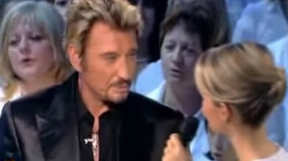 Johnny Hallyday et Laeticia vhantent "Imagine" au profit de l'UNicef en 2006.