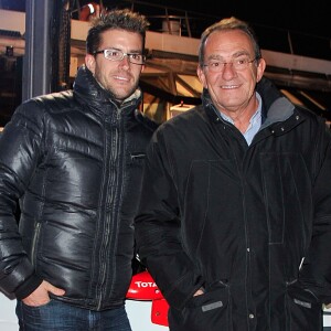 Jean-Pierre Pernaut et son fils Olivier posent devant leur Citroen C4 lors de la conference de presse de la 25eme edition du Trophee Andros a Paris le 27 novembre 2013.