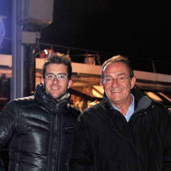 Jean-Pierre Pernaut et son fils Olivier posent devant leur Citroen C4 lors de la conference de presse de la 25eme edition du Trophee Andros a Paris le 27 novembre 2013.