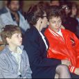 Véronique, Marius et Romain Colucci le jour de l'enterrement de Coluche, le 24 juin 1986.