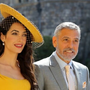 George Clooney et sa femme Amal arrivent à la chapelle S. George pour le mariage du prince Harry et de Meghan Markle au château de Windsor, Royaume Uni, le 19 mai 2018.