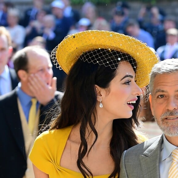 George Clooney et sa femme Amal arrivent à la chapelle S. George pour le mariage du prince Harry et de Meghan Markle au château de Windsor, Royaume Uni, le 19 mai 2018.