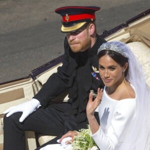 Le prince Harry, duc de Sussex, et Meghan Markle, duchesse de Sussex, en calèche au château de Windsor après la cérémonie de leur mariage au château de Windsor, Royaume Uni, le 19 mai 2018.