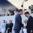 Emmanuel Macron, président de la République, sa femme Brigitte Macron et Taro Kono, ministre des Affaires étrangères - Défilé militaire du 14 Juillet sur les Champs-Elysées à Paris © Hamilton / Pool / Bestimage