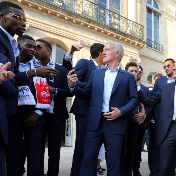 Noël Le Graët , Paul Pogba, Ousmane Dembélé, Presnel Kimpembe, Didier Deschamps, Alphonse Areola, Emmanuel Macron, Djibril Sidibé, Nabil Fekir, Florian Thauvin - Le président de la République Française E. Macron et la Première dame B. Macron, accueillent les joueurs de l'équipe de France (Les Bleus) et son sélectionneur D. Deschamps, le président de la Fédération Française de Football N. Le Graët et des membres de la FFF, dans les jardins du Palais de l'Elysée à Paris, le 16 juillet 2018. L'équipe de France a été sacrée Championne du Monde 2018, pour la deuxième fois de son histoire, après sa victoire en finale face à la Croatie (4-2) © Sébastien Valiela/Bestimage