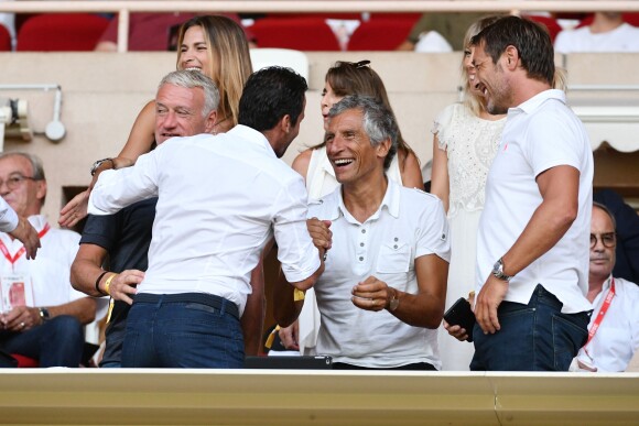 Ludovic Giuly, Didier Deschamps, Nagui, Cyril Rool, leurs femmes au second rang Mélanie Page, Claude Deschamps et des amis durant le Match de football de Ligue 1 opposant Monaco à Lille au stade Louis II le 18 août 2018.